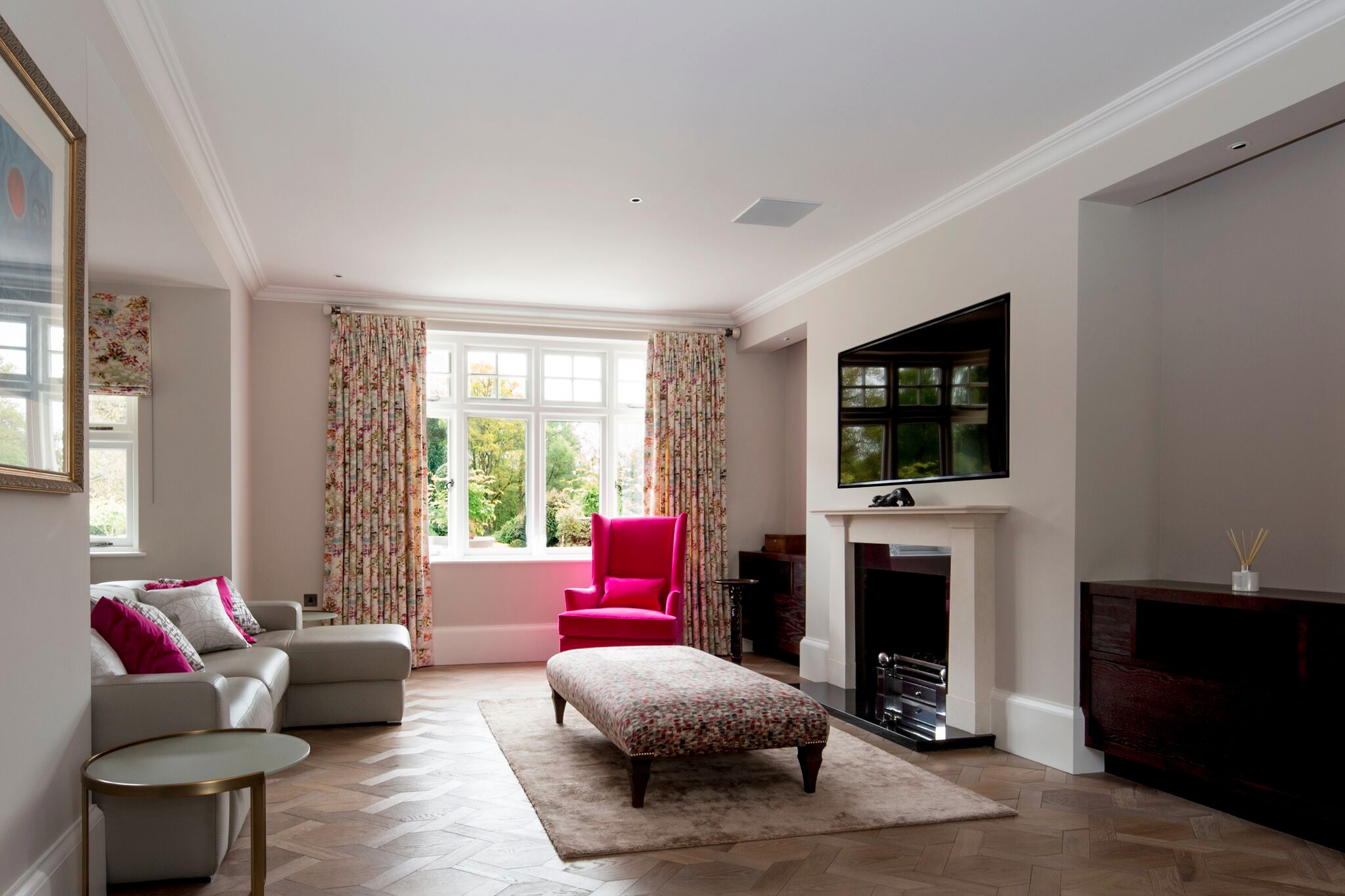 Wall mounted television above a fireplace